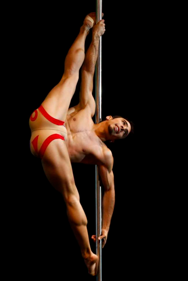 Naked female pole dancer