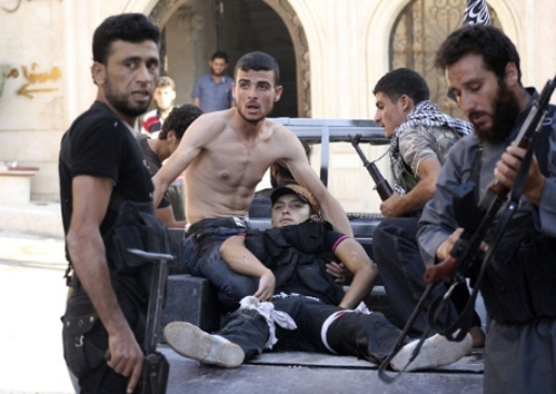 Những đứa trẻ mắc kẹt giữa khói lửa chiến tranh Syria - Hình 13