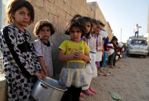 Những đứa trẻ mắc kẹt giữa khói lửa chiến tranh Syria - Hình 16