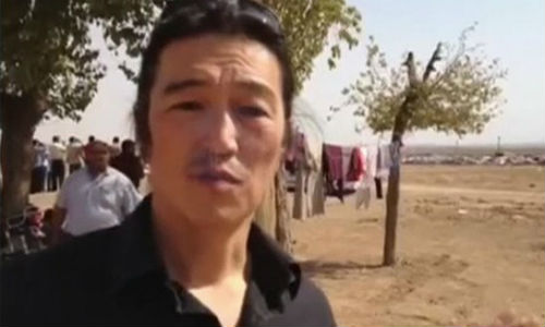 IS tung video hành quyết con tin Nhật Bản Kenji Goto - Hình 1