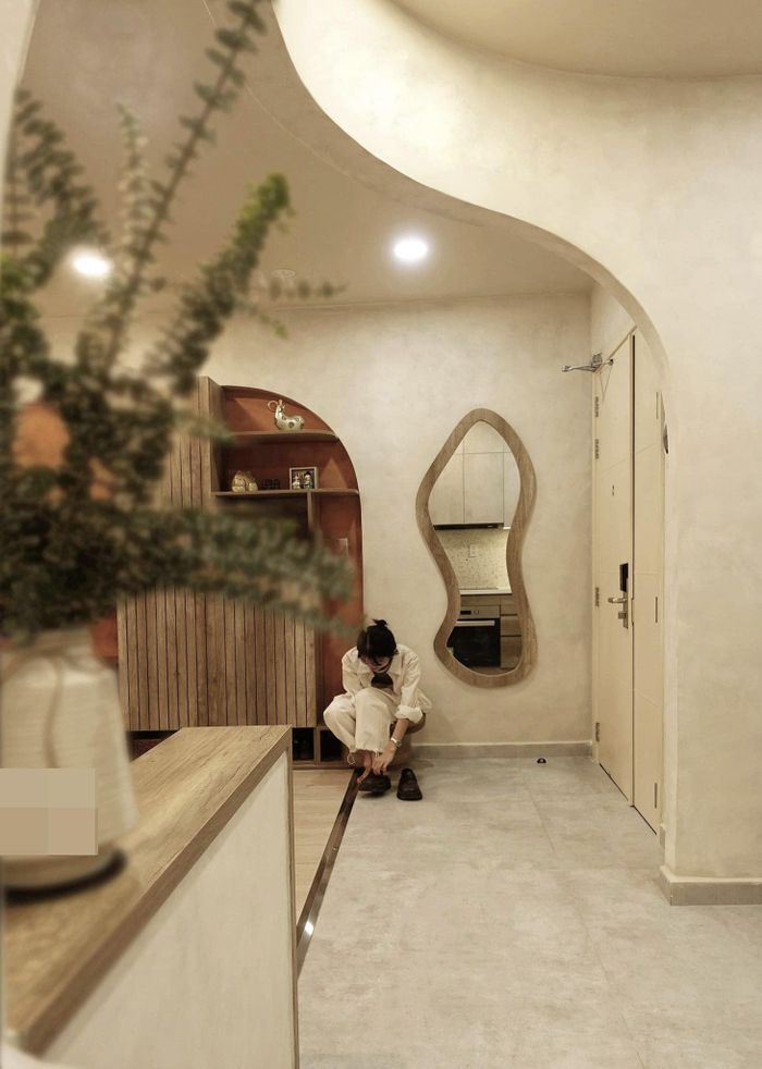 Căn hộ 75m2 phong cách Wabi-sabi tạo không gian mở bằng vách cong - Hình 1