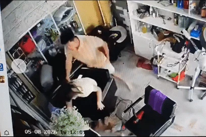 Công an vào cuộc vụ người phụ nữ ôm con nhỏ bị hành hung ở Hà Nội - Hình 1