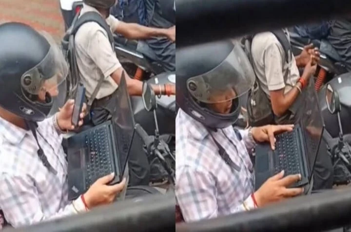 Bức ảnh gây bão mạng toàn thế giới: Mở laptop làm việc khi xe máy chờ đèn đỏ - Hình 1